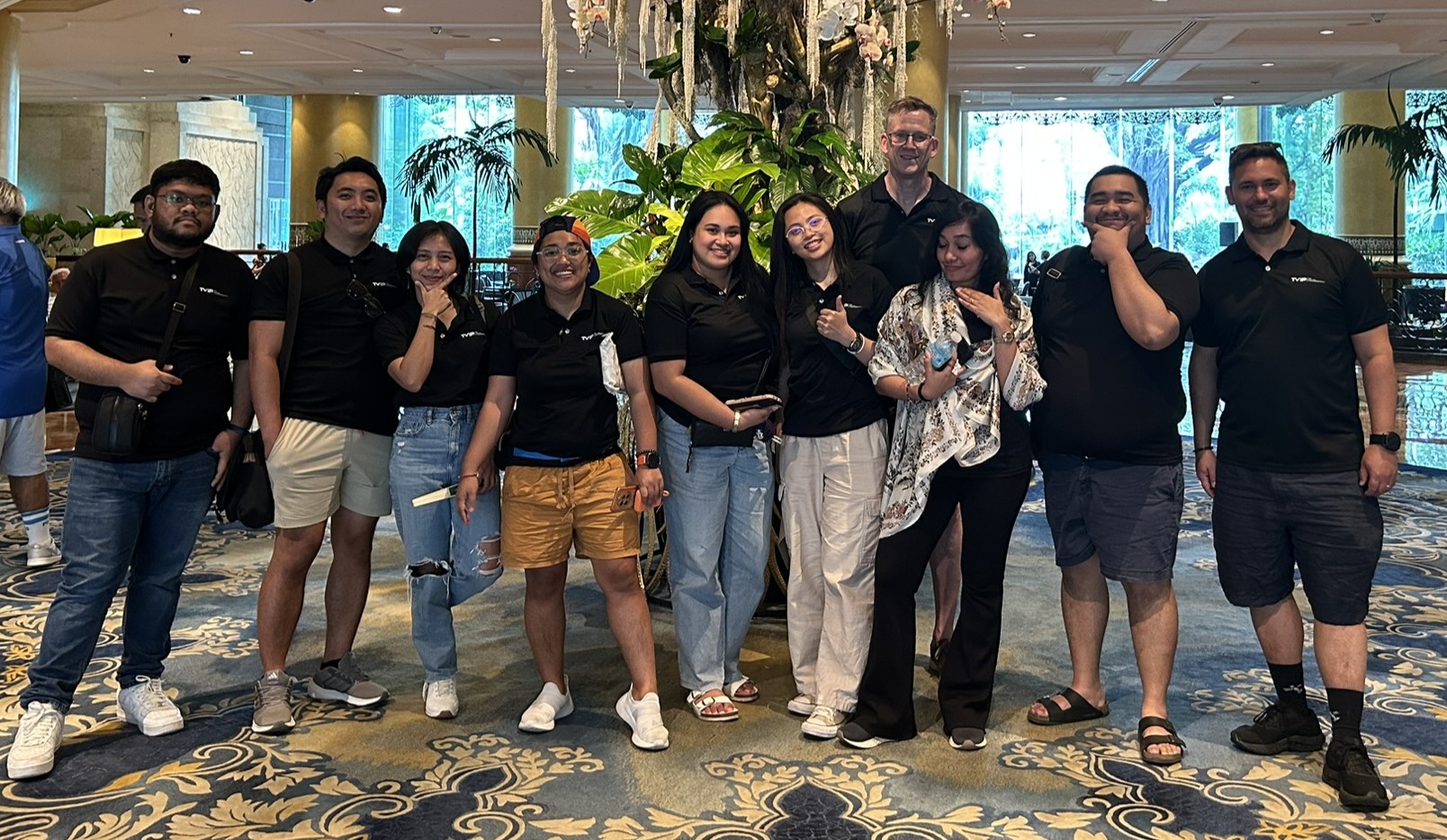A group of happy employees looking at you